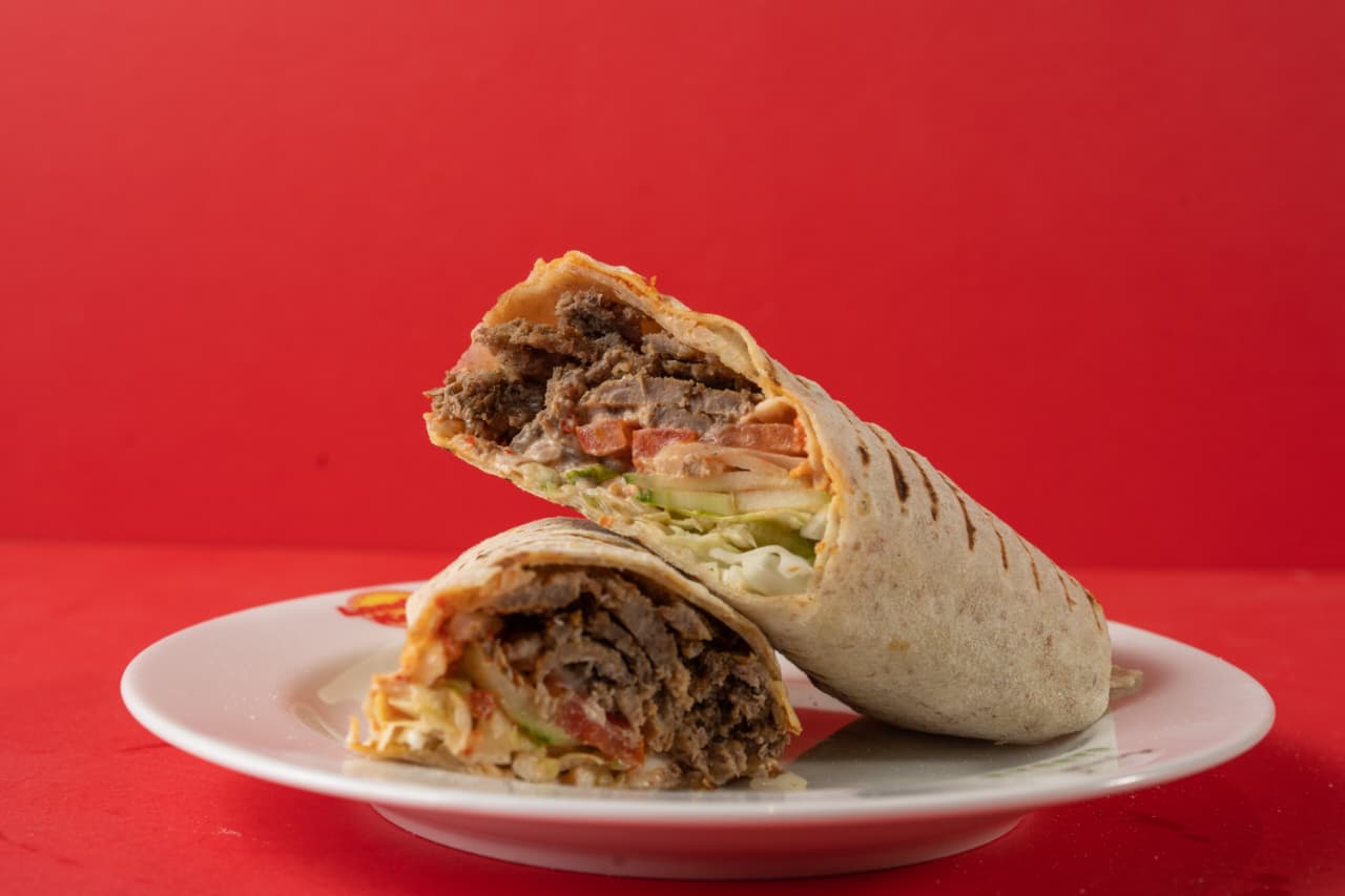Beef doner wrap sliced open on a plate