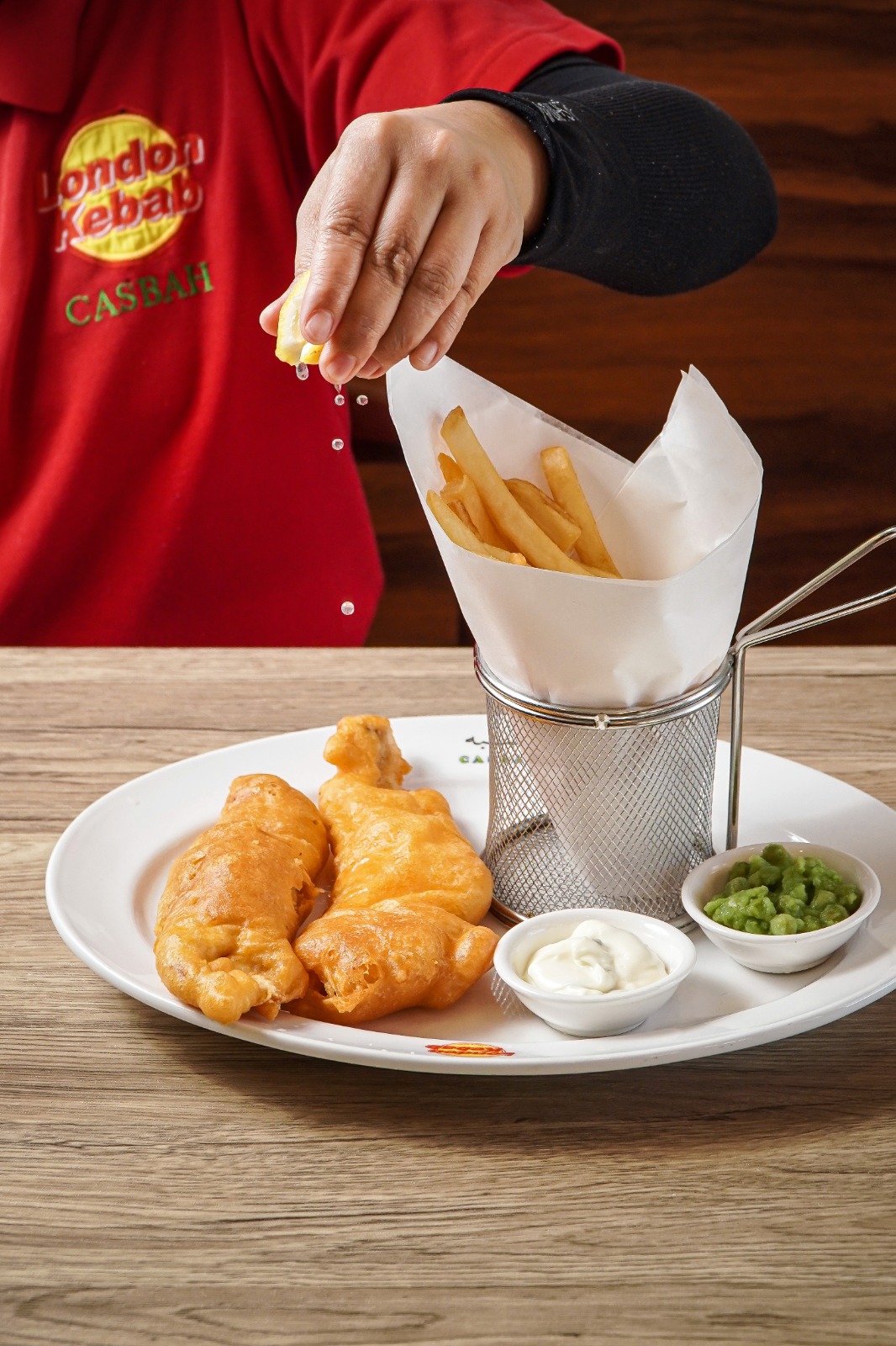 Battered fish and chips with mushy peas