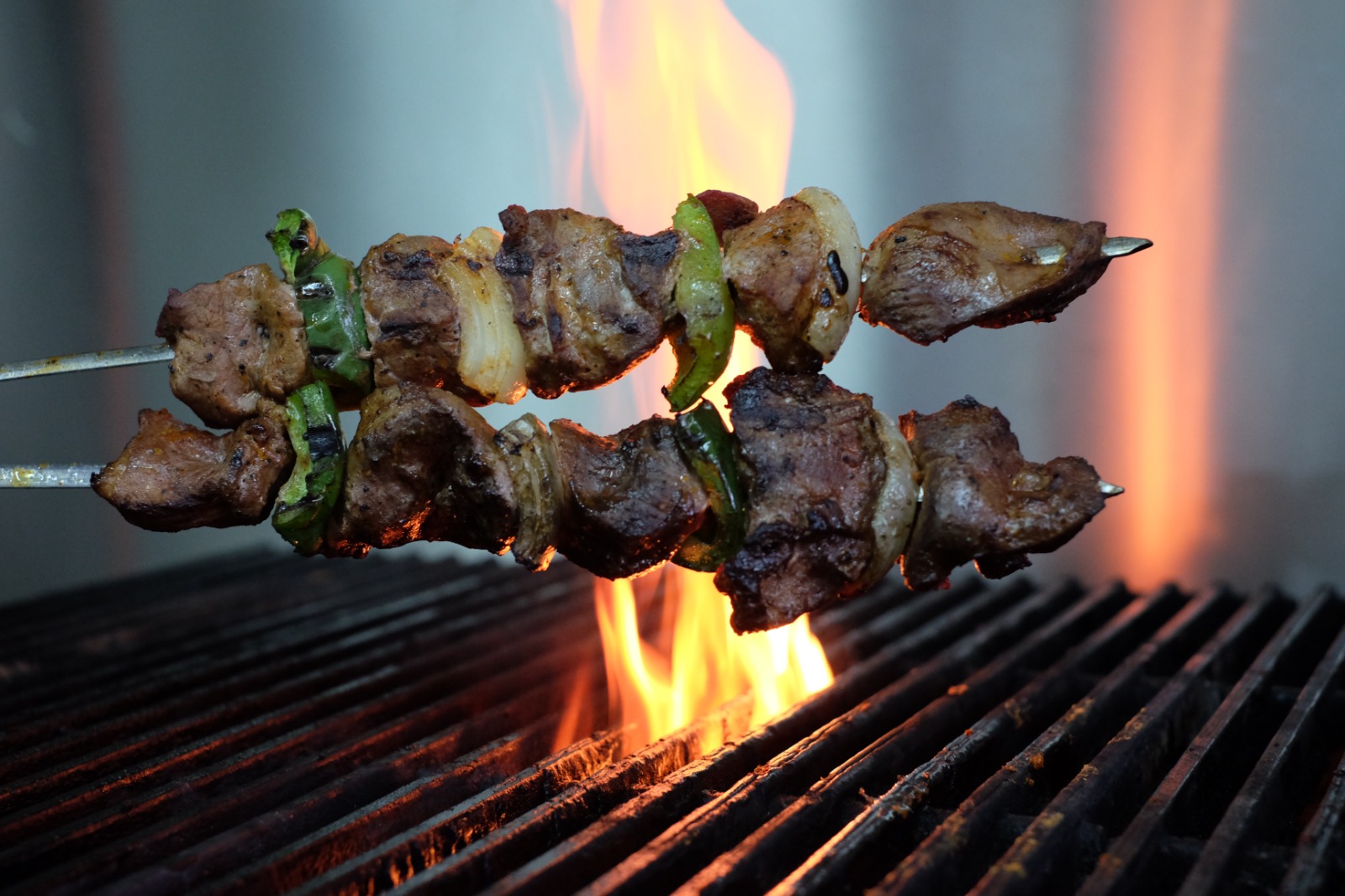 Lamb shish skewers flame-grilled over open fire