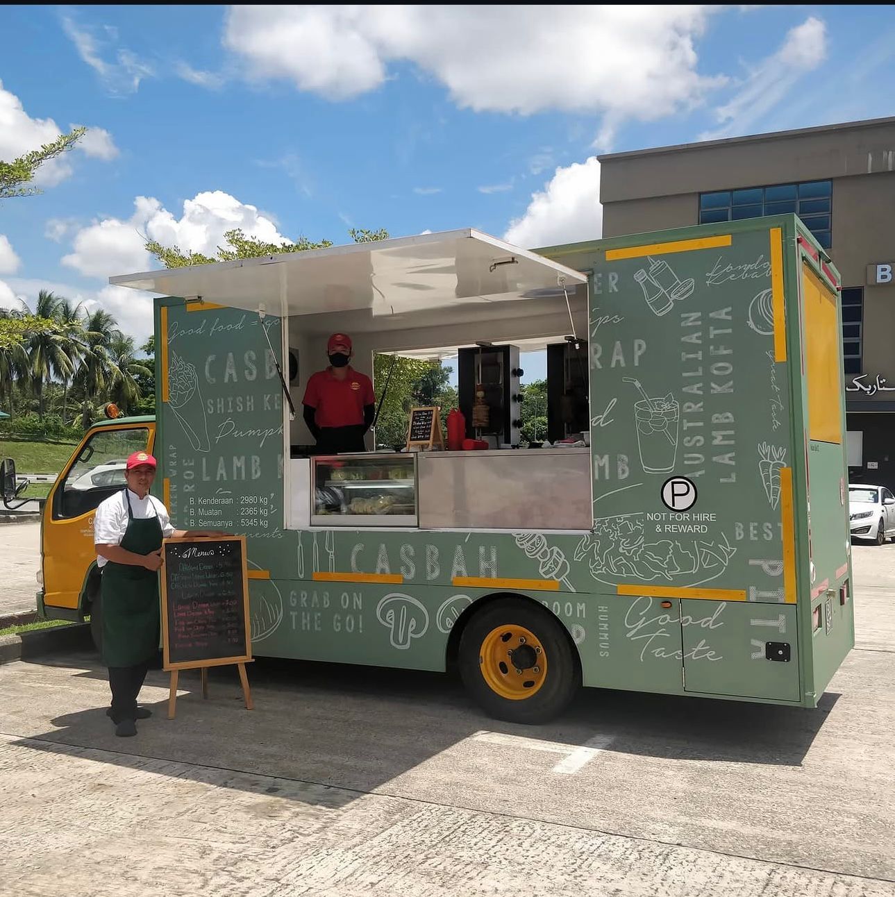 CASBAH food truck with staff serving freshly cooked kebabs and fish & chips at an outdoor event
